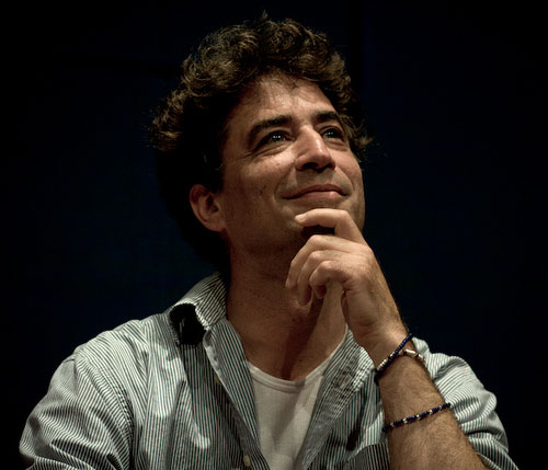 photo of Michael Hardt looking up and smiling