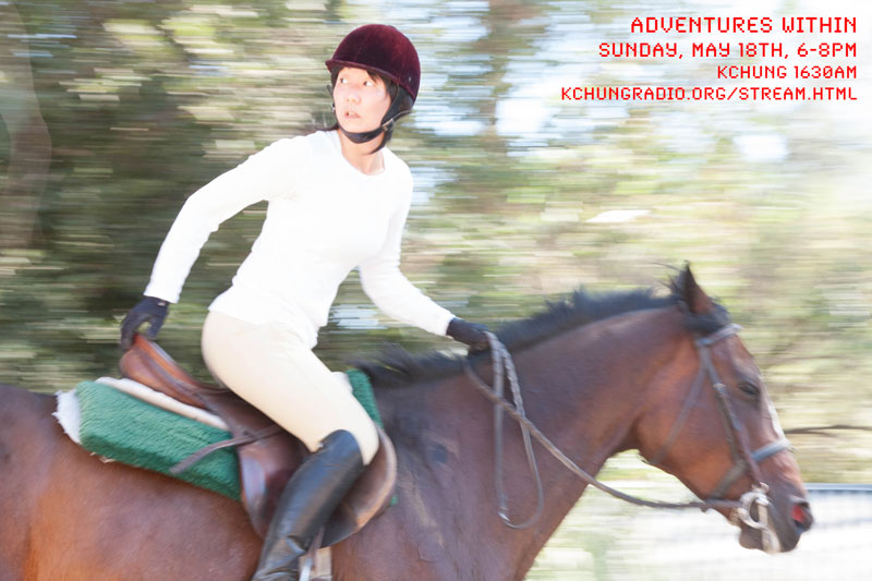photo of Jennifer riding a horse, looking behind her as if something is chasing them